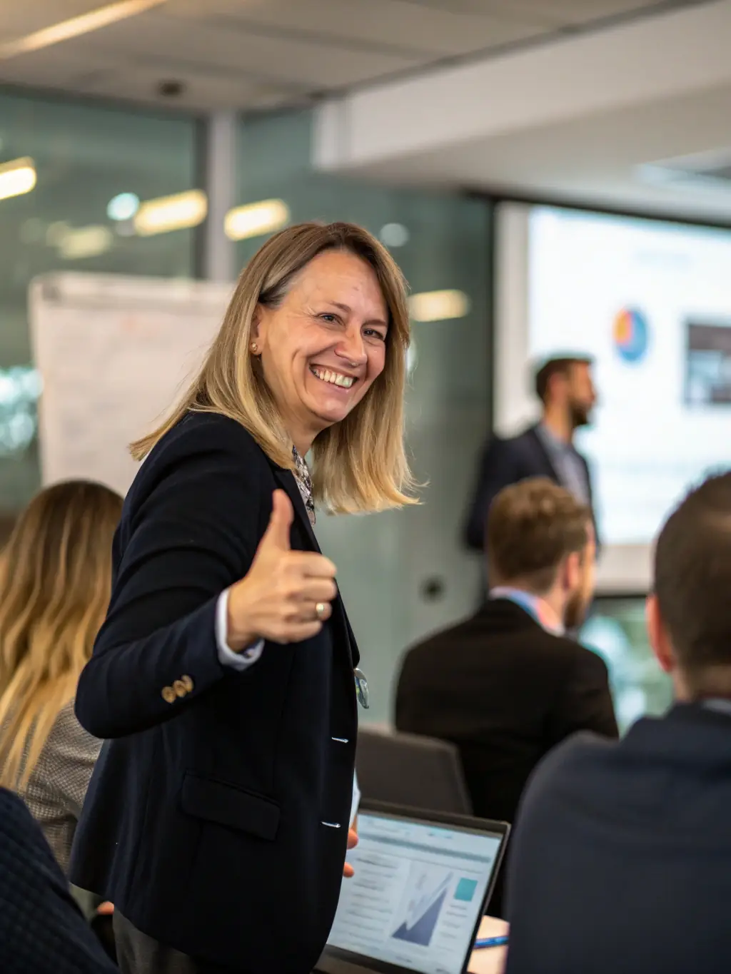 An image featuring a customer smiling and giving a thumbs up, representing high satisfaction, with the SWB Solutions logo subtly displayed.